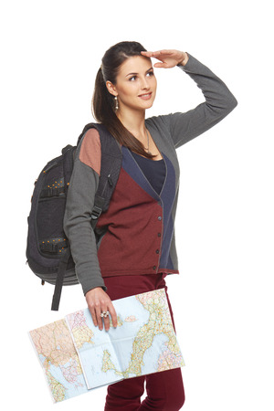 Happy woman holding a map and looking forward, isolated over a white backgroundの写真素材