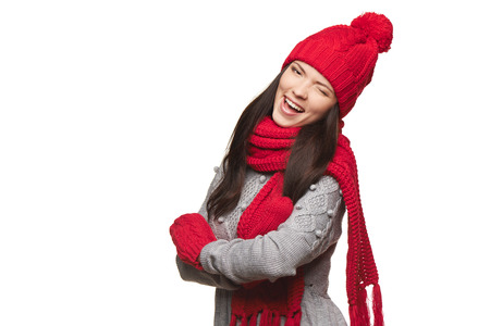 Christmas girl, young beautiful smiling and give a wink over white background
