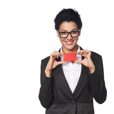 Smiling african american business woman showing blank credit card, over white backgroundの写真素材