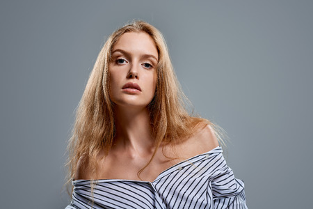 Sensual woman in unbuttoned shirt with temptation expressionの写真素材