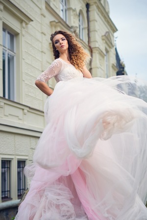 Fashion woman in pink splendid dressの写真素材