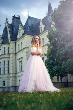 Fashion woman in pink splendid dressの写真素材