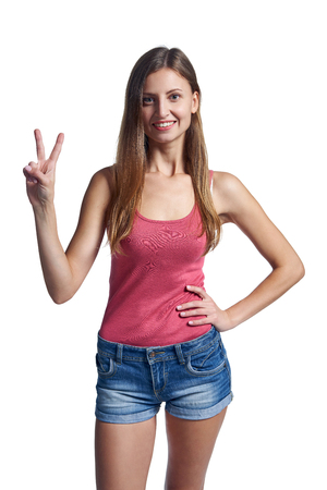 Hand counting - two fingers. Smiling woman showing two fingers, V signの写真素材