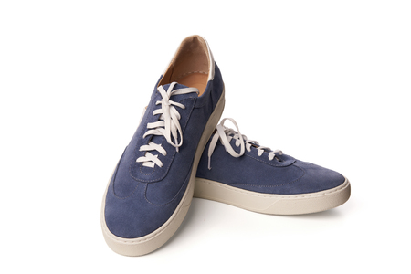 Blue casual suede shoes , Studio shot over white backgroundの写真素材