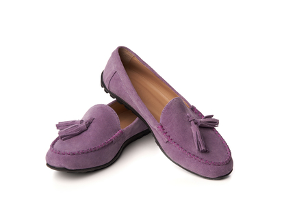 Lilac suede woman's moccasins shoes. Studio shot over white backgroundの写真素材