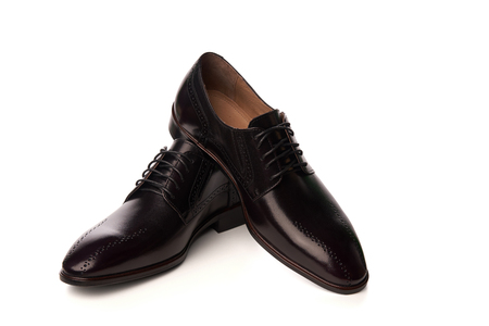 Elegant leather man's shoes. Studio shot over white backgroundの写真素材