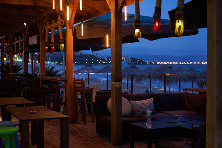 Beach bar in the evening with view at seaの写真素材