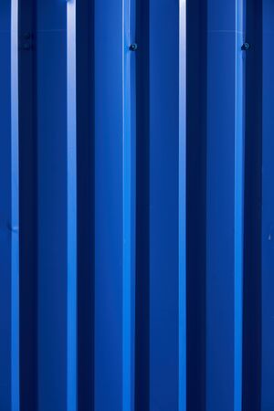 Container pattern. Corrugated metal profiled panel. Metal rivets. Background of blue metal siding, corrugated iron sheet for exterior decoration