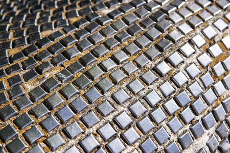 Abstract metal tile mosaic background, shallow depth of field