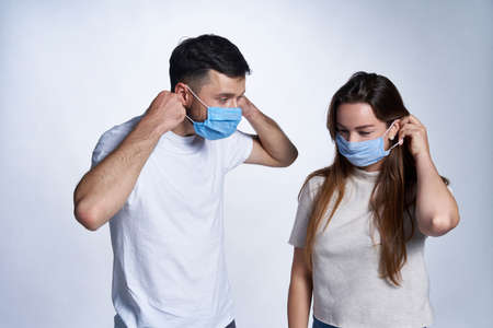 Young couple wearing medicine masksの写真素材