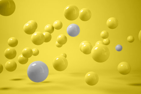 Color trends 2021. 3D render of scattered yellow and grey balls levitating on yellow backgroundの写真素材