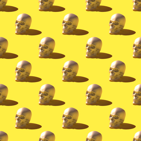 Seamless pattern of 3D render skulls over bright yellow backgroundの写真素材