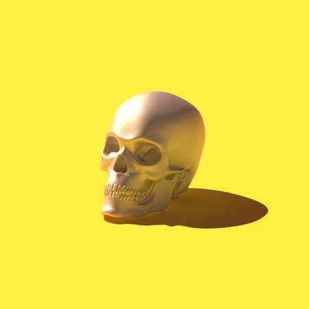 Golden 3D rendering skull over bright yellow backgroundの写真素材
