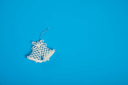 Christmas decorative Jingle Bells on blue backgoundの写真素材