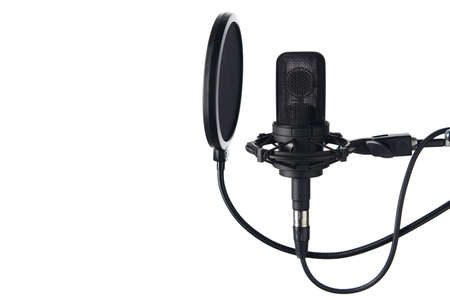 Black studio condenser microphone with pop up filter, isolated on white background, with copy space on leftの写真素材