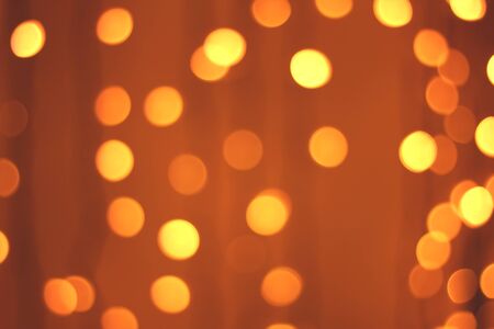 Defocused gold abstract christmas background. Golden and yellow circle backgroundの写真素材