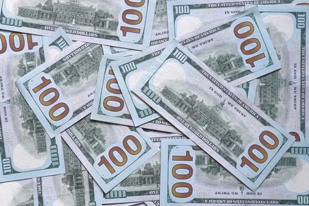 Background of one hundred dollar bills. Independence hall on USA money banknote.  American dollars banknotes background. US dollars pattern. 100 dollars. Close-up selective focusの写真素材