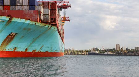 Container cargo ship load in the seaport. Logistics and transportation of Container Cargo ship with...