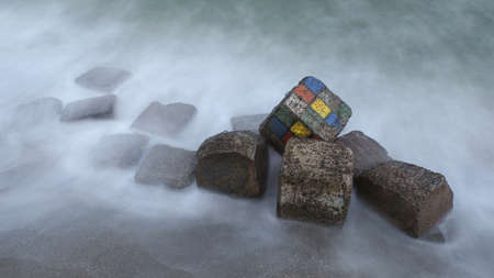 Colorful concrete cubes in the surf of the sea in the evening. Dark photo, long exposure. concept: creative design solutions to improve the urban environmentの写真素材