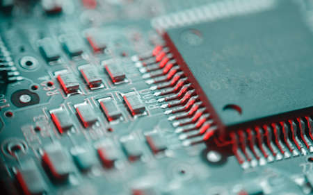 Computer Microchips and Processors on Electronic circuit board. computer hardware technology. Abstract technology microelectronics concept background. Macro shot, shallow focus.の写真素材