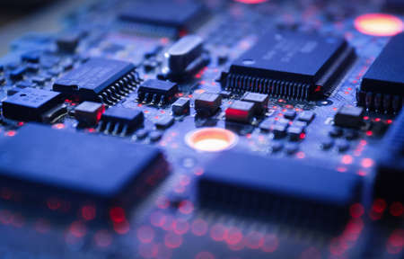 Computer Microchips and Processors on Electronic circuit board. computer hardware technology. Abstract technology microelectronics concept background. Macro shot, shallow focus.の写真素材