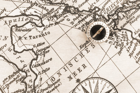 Magnetic old compass on world vintage map.Travel, geography, navigation, tourism and exploration...