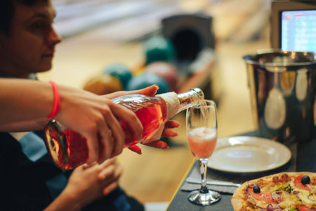 Wine is poured into a glassの写真素材