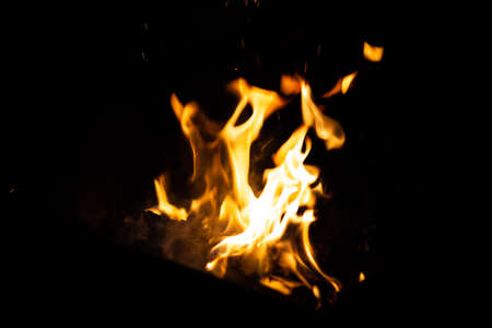 flames of fire on a black background close-upの写真素材
