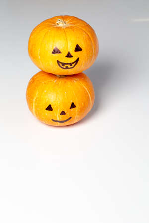 Halloween pumpkin with face isolated on whiteの写真素材