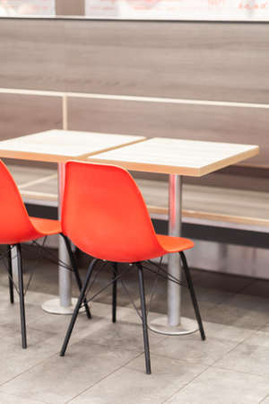 Empty office furniture in the form of a chair and table indoors.の写真素材