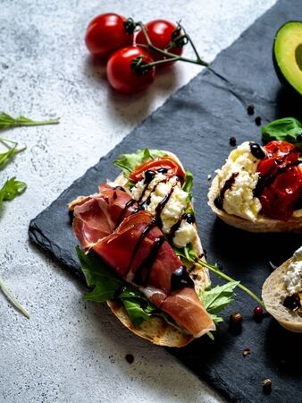 Assorted bruschetta with various toppings.の写真素材
