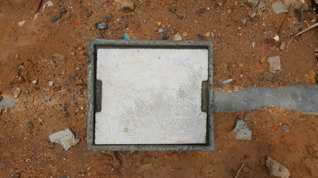 concrete manhole on ground and stone backgroundの写真素材