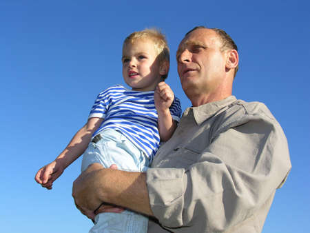 grandfather with grandson look at horizon and future