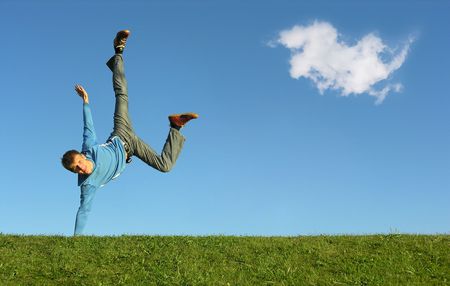 man on hand on blue sky with cloudの写真素材