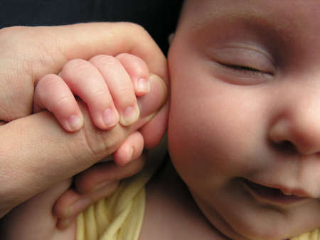 baby sleep with father's finger