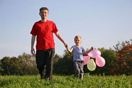 father with son and balloonの写真素材