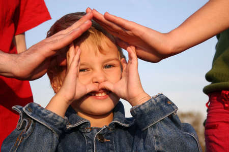 child and family's hands houseの写真素材