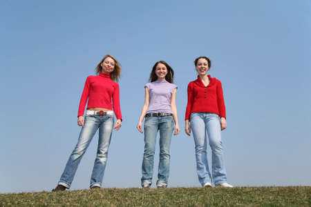 girls stand on meadowの写真素材