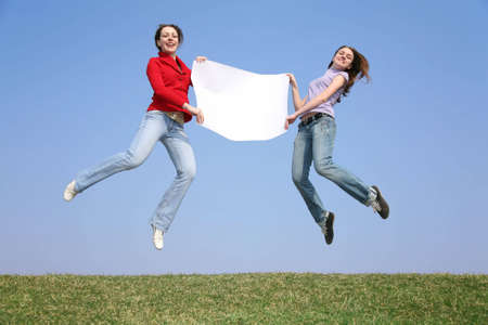 jump girls with paperの写真素材