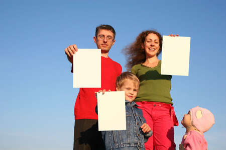 family with cards for textの写真素材
