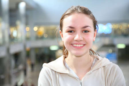 smile girl in big hallの写真素材