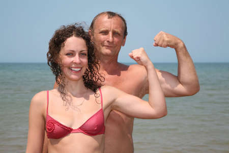 Father and daughter show bicepsesの写真素材