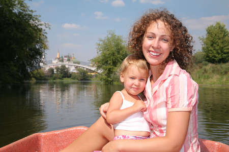 mother with the daughter in the boatの写真素材