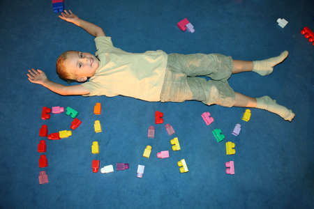 boy laying on floorの写真素材
