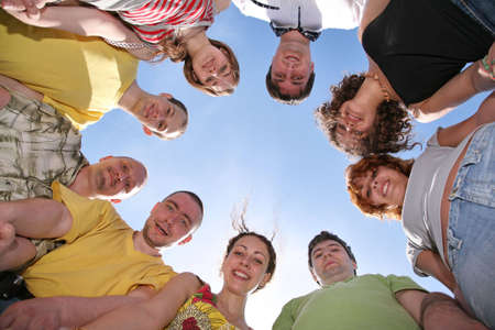 Group of nine friends are in a circleの写真素材