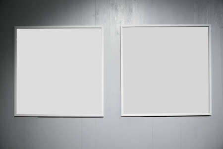 two frames on white wood wallの写真素材