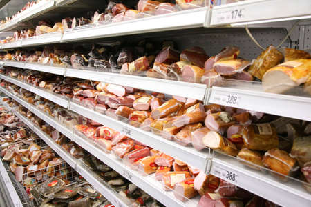 shelfs with smoked meatの写真素材