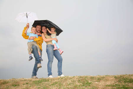 family with the umbrellasの写真素材