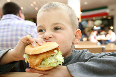 boy eats the sandwichの写真素材