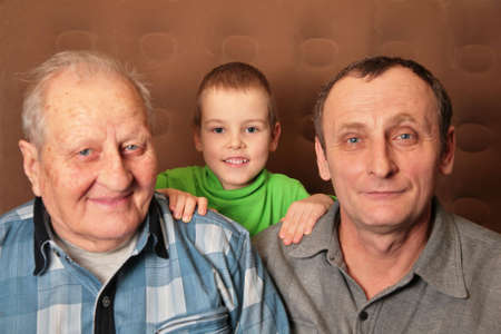 two elderly men with boy